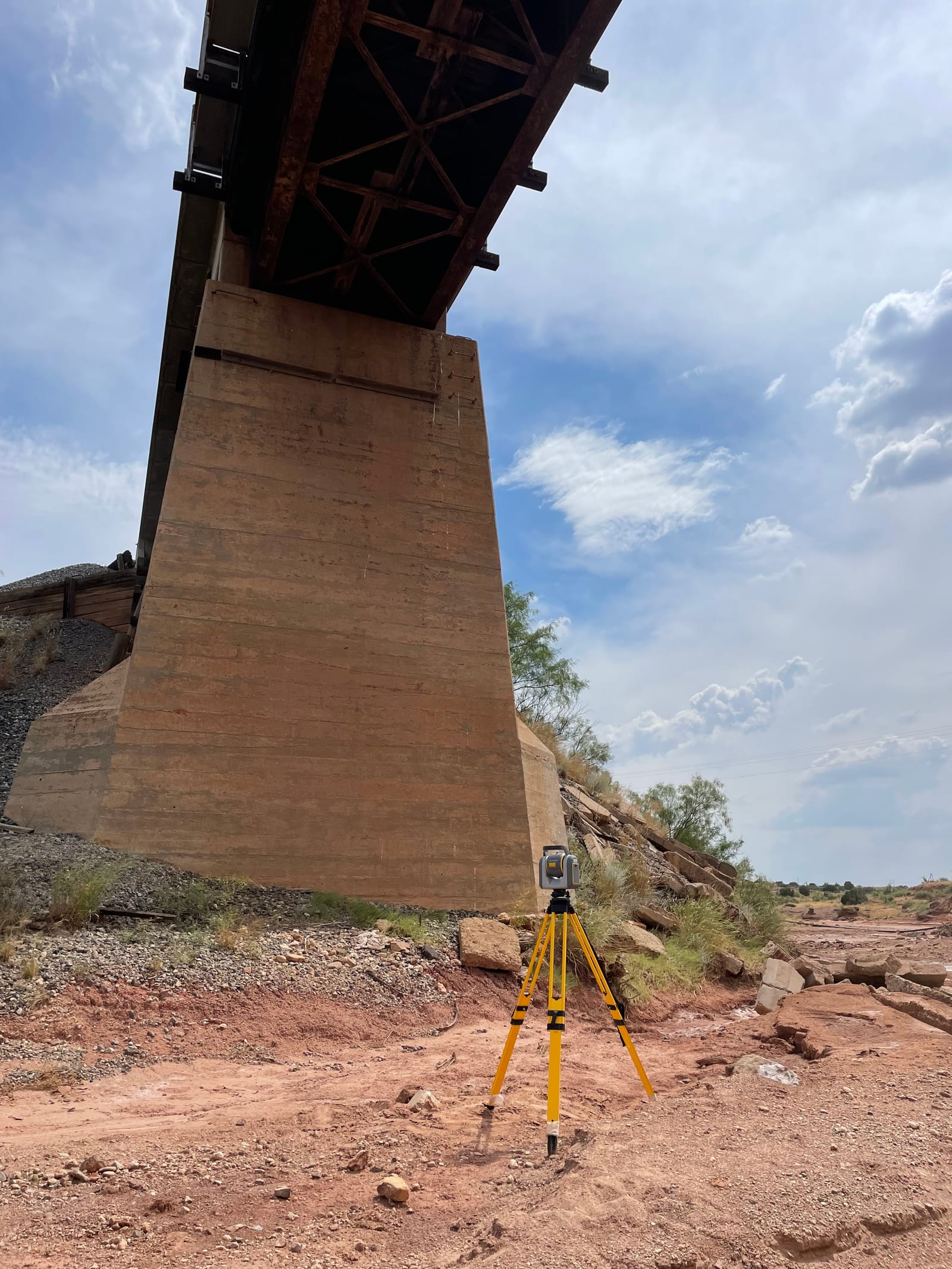 Structural consulting — laser scanner documenting a bridge pier and substructure